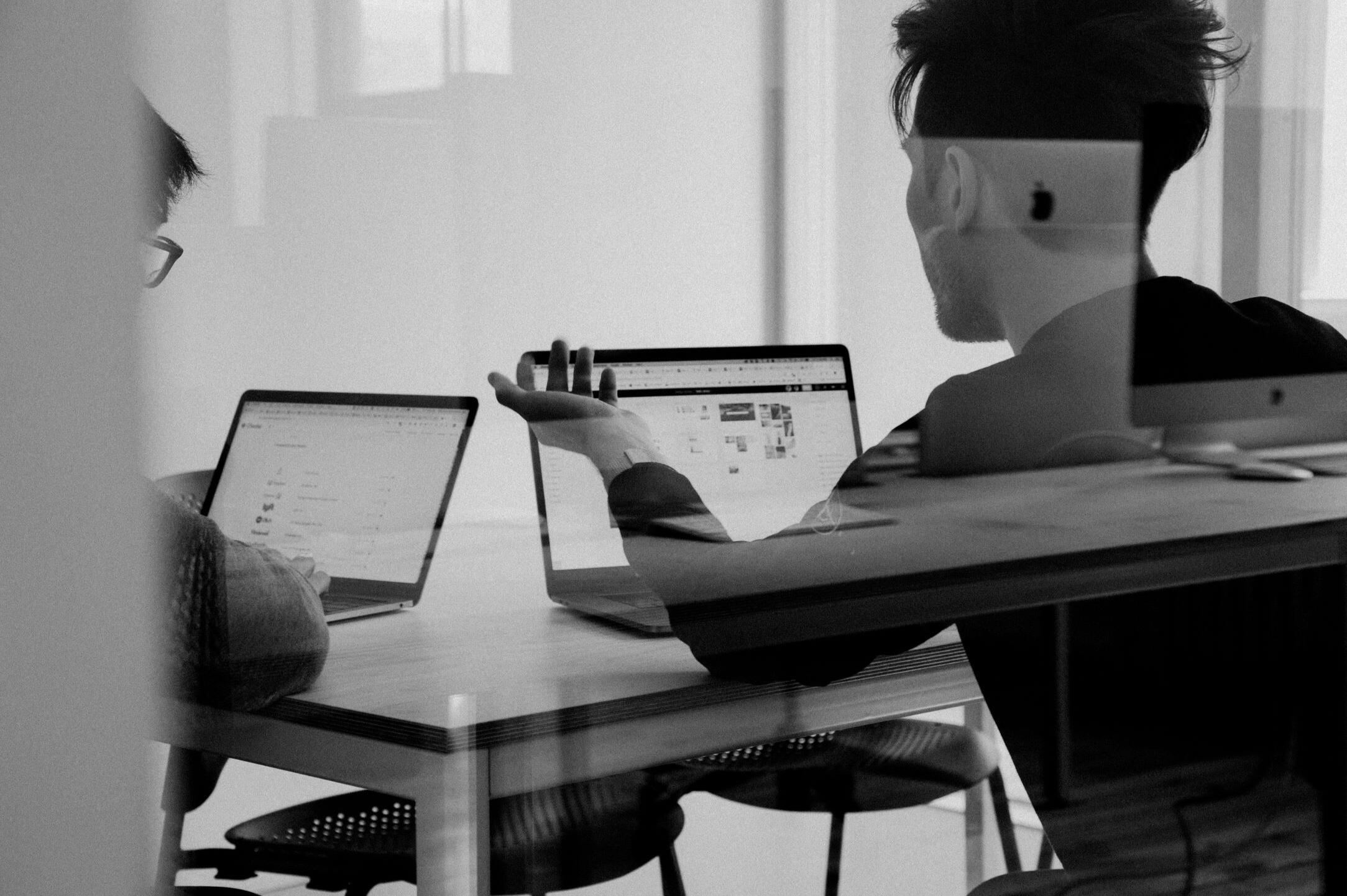 About Havana & Co. Business professionals collaborating around laptops in a modern workspace