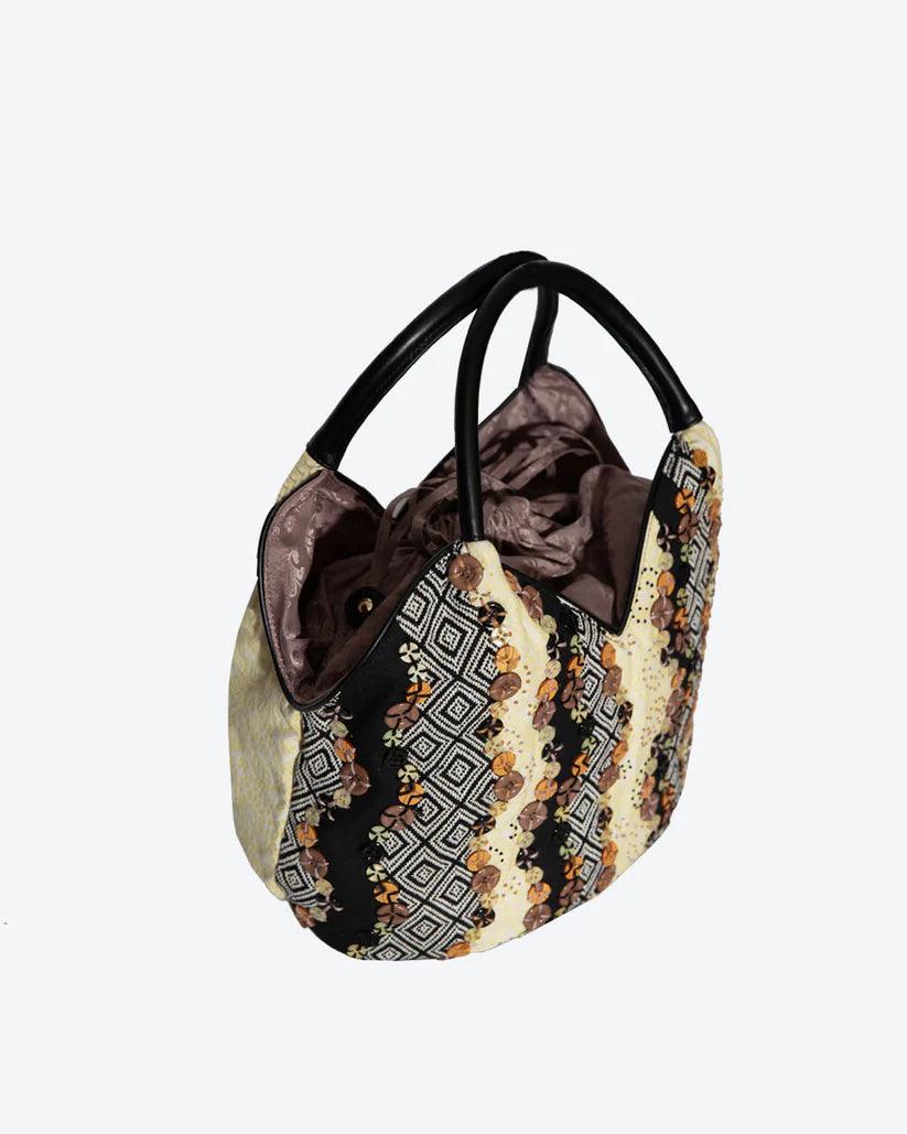 Doris Patchwork Bucket Bag by Havana & Co. with decorative buttons and unique fabric design