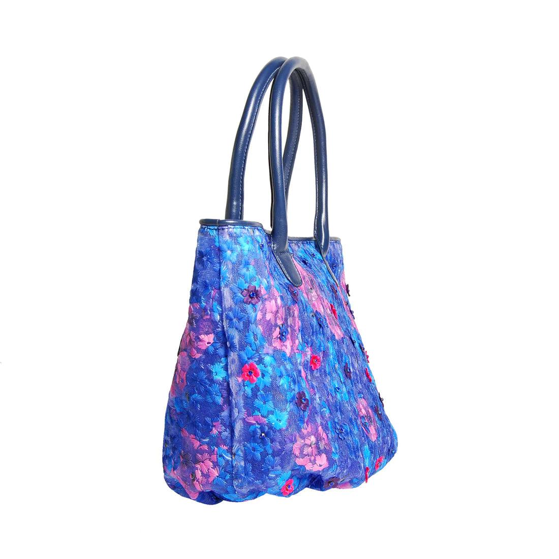 Eden Floral Mesh Bucket Bag by Havana & Co. – Lightweight mesh bag with handsewn 3D flowers and vegan leather handle, perfect for summer elegance.