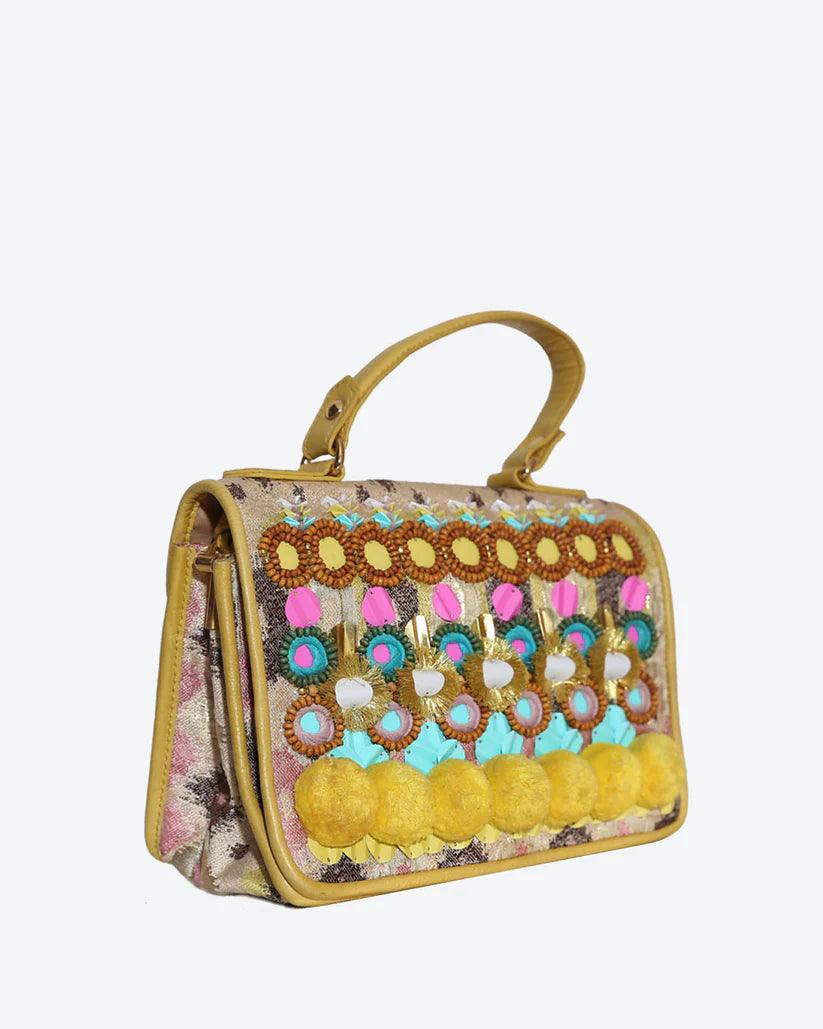 Nandina Embellished Crossbody Bag in Yellow by Havana & Co. – Metallic jacquard and leather bag with intricate handmade embellishments.