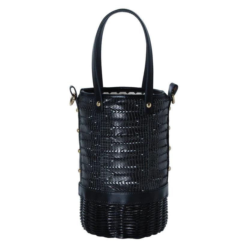 Tory Small Rattan Basket in Black by Havana & Co. – Hand-woven rattan and raffia bag with leather details and colorful drawstring lining.